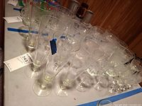 Wide view of assorted etched stemware on table
