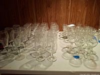 Full assortment of clear glass stemware on table