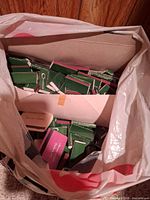 Plastic bag filled with numerous green Cavaliere matchbooks and others