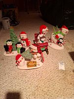Group shot of all four Hallmark plush figurine scenes