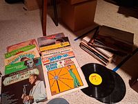 Overview of lot showing records laid out and stacked; visible Ray Conniff, Herb Alpert, Cabbage Patch Kids, Merry Christmas, Annie, Wizard of Oz etc.