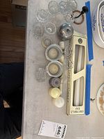Entire lot showing candles, glass pieces and metal items