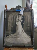 Full view of framed wedding photograph showing overall design and dimensions context