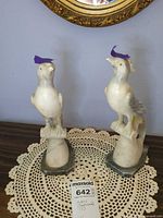 Front view of both marble/alabaster bird sculptures on bases