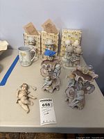Lot overview showing two vases, broken wall figure and background items