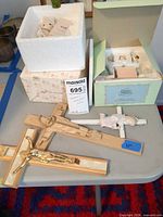 Overall lot showing crosses, boxes and loose figurine