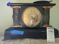 Front view of Seth Thomas mantel clock showing entire case, dial, and dimensions tag