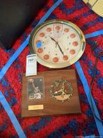 Round basketball wall clock and wooden plaque with Shaq card and small clock