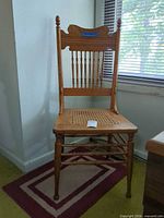 Full view of oak chair showing overall design and condition