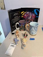 Entire lot: boxed plate, two mugs, four figurines