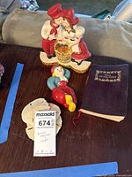 Group shot of figurines, book and sand dollars on table