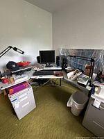 Overall view of L-shaped desk set up as workstation