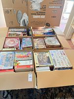 Overview of six open XL boxes filled with puzzle boxes