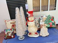 Full group: two pearl cone trees, snowman, Santa, several pillows including cat motif