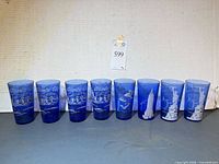Eight cobalt tumblers lined up