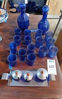 Full lot view: two decanters, sixteen tumblers, chrome tray with three lidded condiment bowls