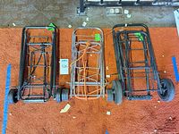 All three folded luggage carts side by side for overview