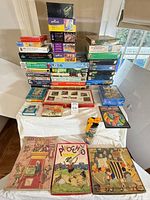 Group shot of entire assortment of puzzle boxes on table