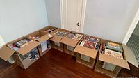Seven U-Haul boxes filled with puzzle boxes