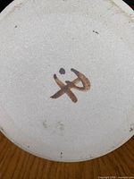 Base of jug with artist signature
