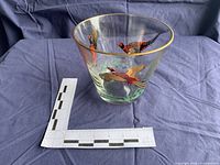 Martini-style glass with painted design, measurement scale visible