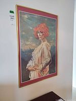 Full view of framed portrait print hanging on wall