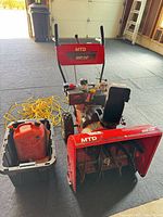 Full view of snowblower with accessories