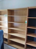 Front view showing both oak veneer bookcases side by side