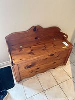 Front view of pine storage bench closed