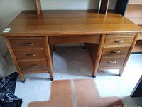 Front view of mission desk showing seven drawers and keyboard tray