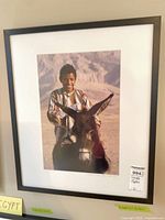 Full view of framed photograph showing image, mat and frame