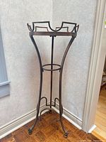 Full view of plant stand showing frame and legs