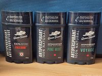 Front view of three Green Beaver antiperspirant sticks showing varieties Freedom, Pine Mint, Voyage