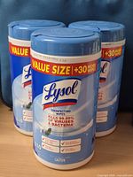 Front view of three sealed Lysol Disinfecting Wipes value-size canisters
