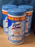 Front view of three Lysol disinfecting wipe canisters showing value size label and 110 wipes count