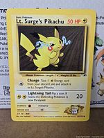 Front view of Lt. Surge's Pikachu card showing artwork, stats and set information
