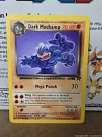 Front of Dark Machamp card showing artwork, stats, attacks, set symbol and numbering