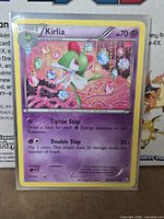 Front of Kirlia RC9 holographic card in sleeve