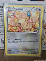 Front of Minccino full-art holographic card in sleeve