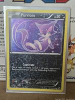 Front of Pokémon Purrloin RC13/RC25 holographic card in sleeve