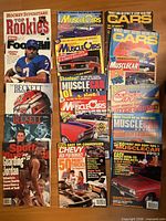 All 18 magazines arranged on floor showing front covers with sports and muscle-car themes