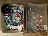 Both boxes showing wine glasses and kitchenware