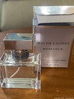 Front view of Ralph Lauren Romance bottle and box showing branding and bottle design