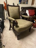Front angled view showing overall chair design, wood frame and upholstery