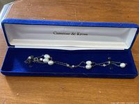 Bracelet inside open blue velvet Camrose & Kross case