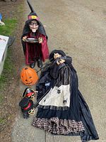 Entire lot showing standing witch, reclining witch, pumpkin, two small heads