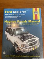 Front cover showing Ford Explorer image, title, coverage years, shrink-wrap intact