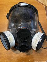 Front view showing full-face respirator and both cartridges attached