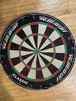 Front view of Winmau Classic dartboard showing scoring segments and logos