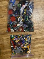 Two ziplock bags filled with assorted Lego pieces